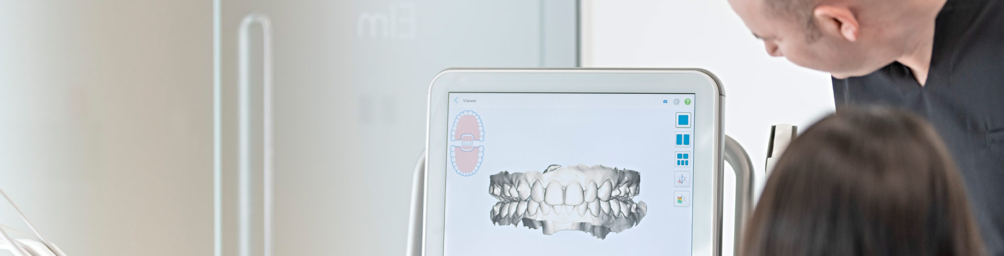 Dentist Looking at 3D Scan Of Teeth