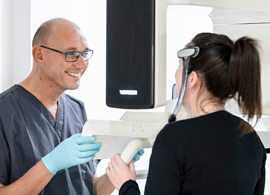 Dentist Taking Scans Of Patient's Mouth