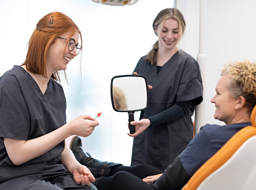 Patient And Dentist Discussing Ways To Pay