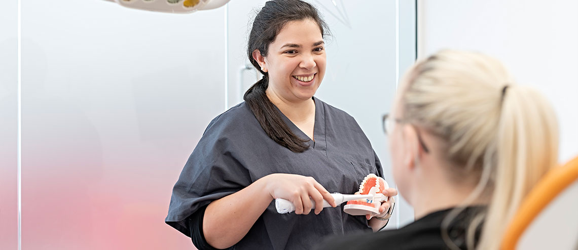 A dentist explaining how have better dental health