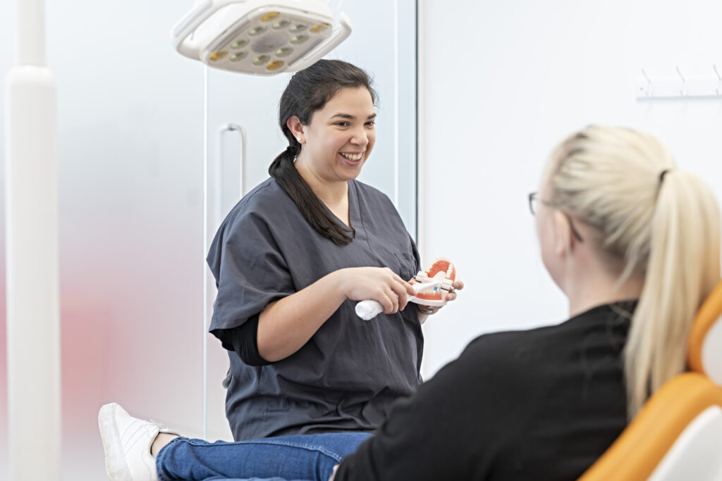 Nervous patient talking to dentist