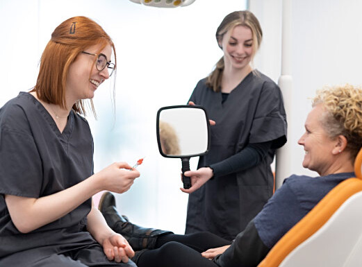 Patient And Dentist Discussing Ways To Pay